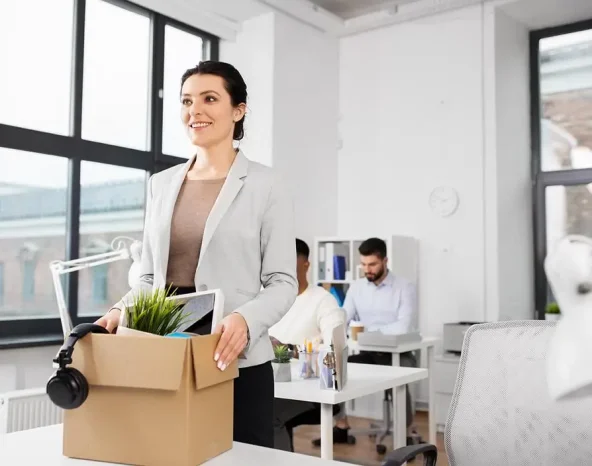 business, new job and corporate concept - happy smiling businesswoman with her personal stuff at office