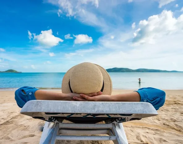 Young woman relaxing on beach, ocean view, Vacation Outdoors Seascape Concept