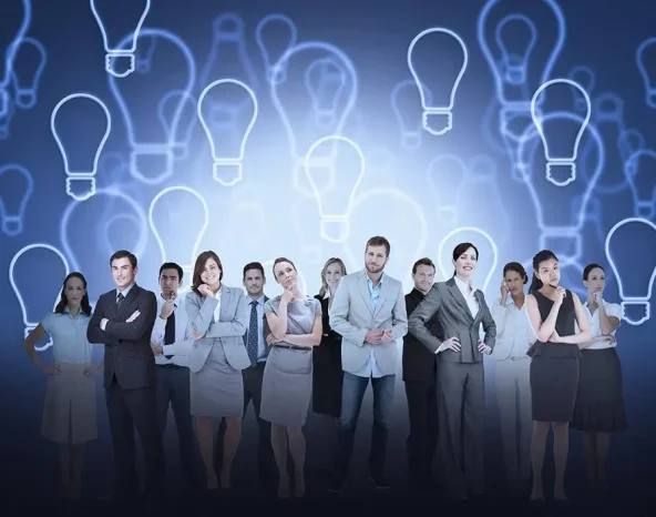 Digital composite of business team against light bulb background