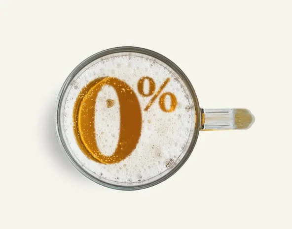 Symbol non alcoholic beer on the beer foam in glass isolated on white background. Top view.