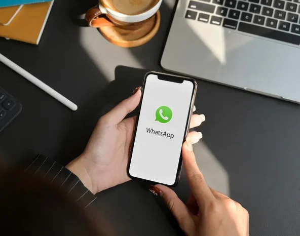 CHIANG MAI, THAILAND - FEBRUARY 1, 2020 : female using WhatsApp application on iPhone. WhatsApp is multi-function messaging application